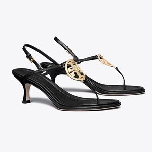 Never worn Tory Burch black thong sandals with gold emblem size 7.5.